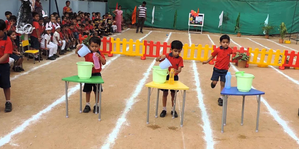 Bottle Filling Competition For Kids In Kindergarden Sports Day.