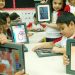 Preschooled Kids Holding Tablet In Their Hand - Replicates Technology Concept In Kindergarden.