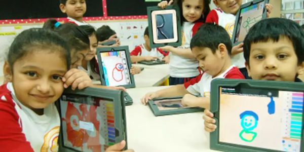 Preschooled Kids Holding Tablet In Their Hand - Replicates Technology Concept In Kindergarden.