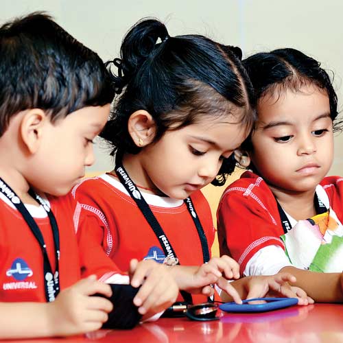 3 Kindergarden school students using android mobile