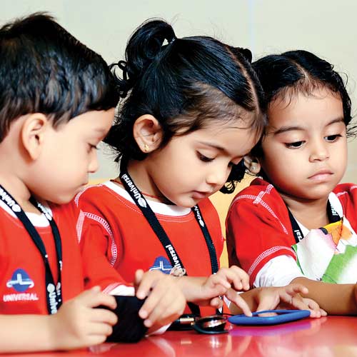 3 Kindergarden school students using android mobile