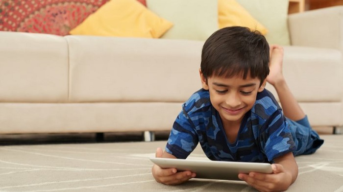 A Little Boy Studying Through His Tablet.